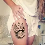 floral thigh tattoos